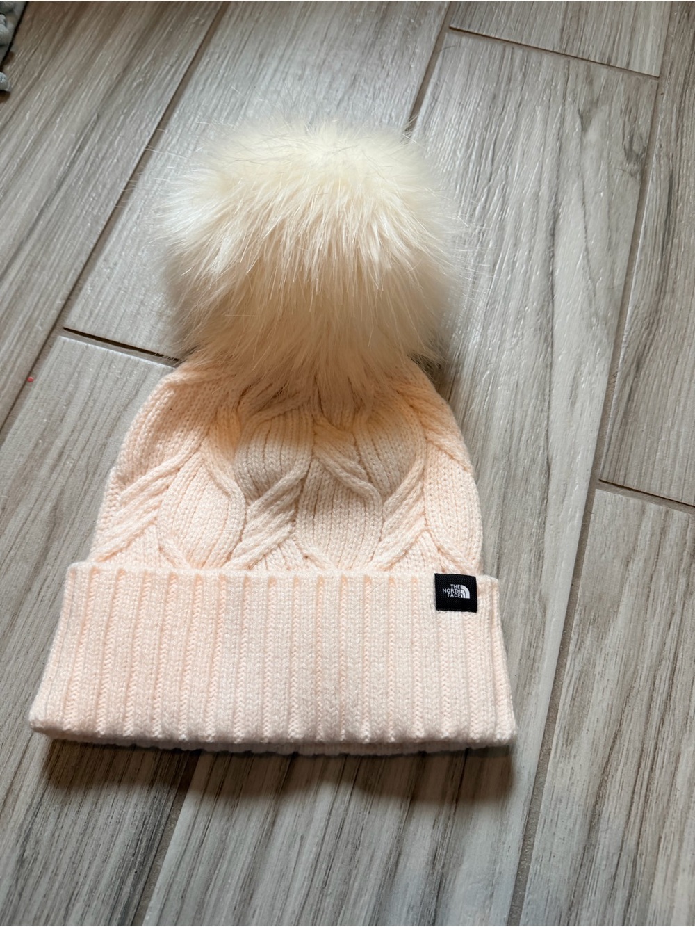 The North Face women’s Pink Pom Beanie - Soft Cable Knit